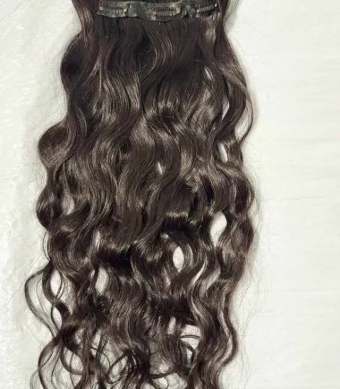 Three-piece natural black wavy clip-in hair extensions
