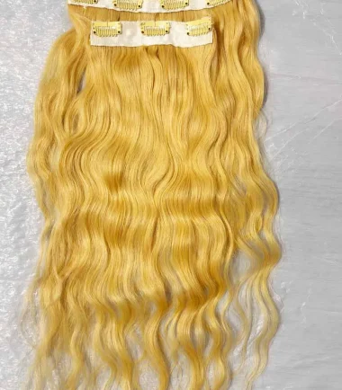 Three-piece blonde wavy clip-in hair extensions